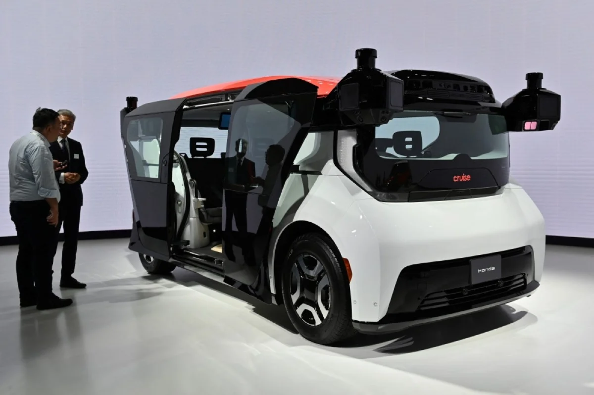 TOKYO: The Cruise Origin, a self-driving vehicle with no steering wheel or pedals, is displayed at the Honda Motor's booth during the press day of the Japan Mobility Show in Tokyo on October 25, 2023. -- AFP