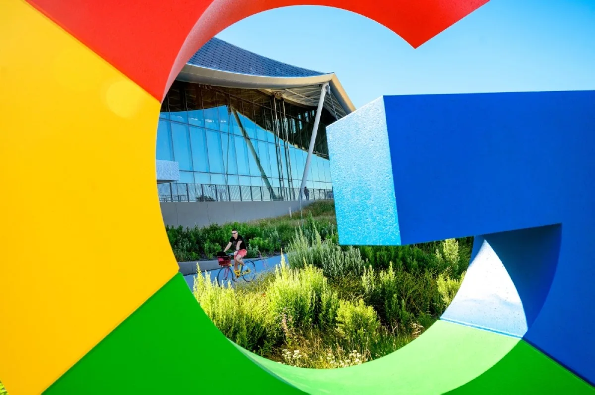 MOUNTAIN VIEW, United States: A bicyclist rides along a path at Google’s Bay View campus in Mountain View, California, on June 27, 2022. Whether they sell smartphones, ads or computer chips, the heavyweights of Silicon Valley have everything to prove to investors looking to see who is best placed in the race to dominate the generative artificial intelligence market.-- AFP