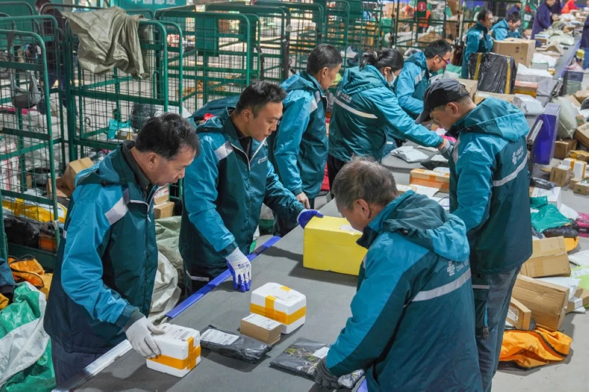 ZOUPING, China: Workers sort packages for delivery ahead of the Singles’ Day shopping festival at a logistics center in Zouping, in China's eastern Shandong province on November 10, 2023.—AFP