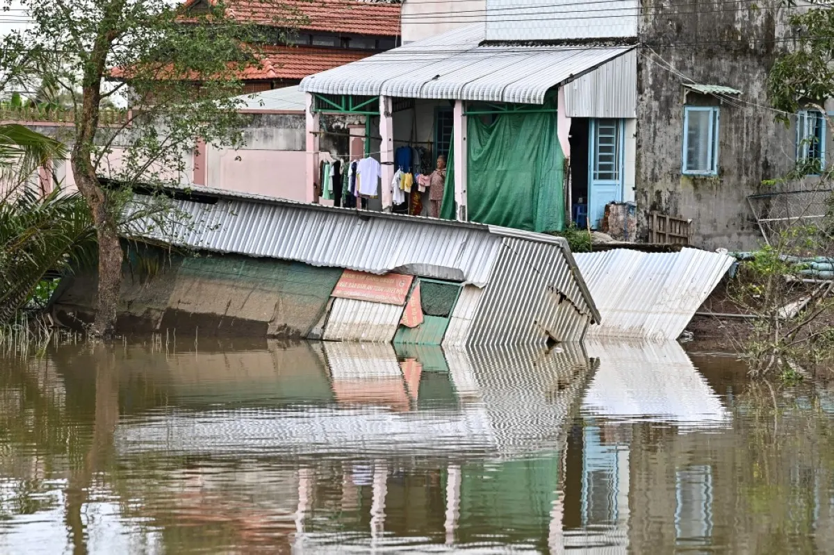 CAN THO,Vietnam: This photo taken on October 26, 2023 shows the site where resident Le Thi Hong Mai's house collapsed into the Hau river due to erosion in Can Tho city in southern Vietnam. -- AFP?