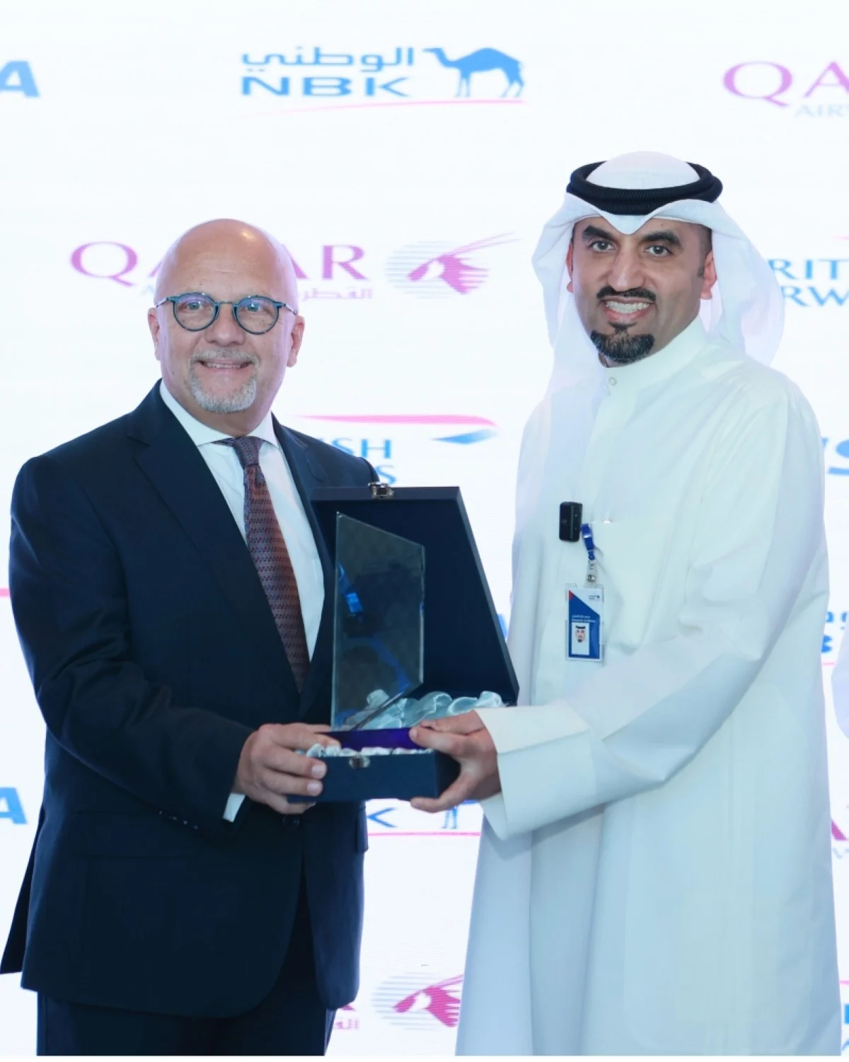 Al-Othman (right) and Marwan Koleilat on the sidelines of the ceremony.