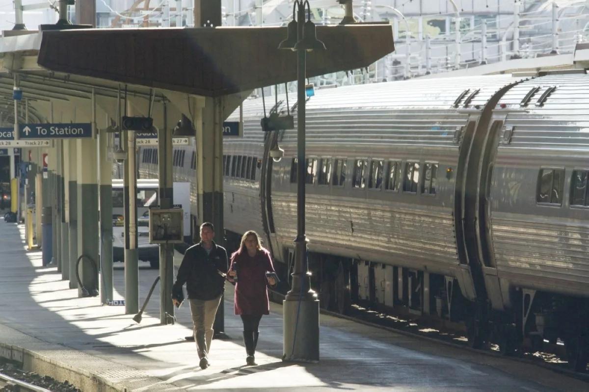 WASHINGTON: Laura Mason (right), executive vice president for capital delivery at Amtrak, walks on a platform at Union Station in Washington, DC. – AFP