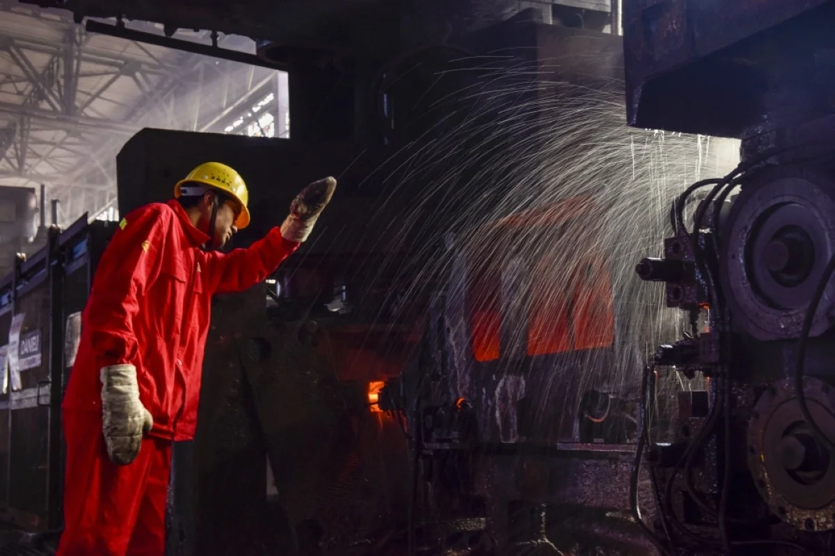 HUAIAN, China: This photo taken on December 3, 2023 shows an employee working at a steel plant in Huaian, in China's eastern Jiangsu province. – AFP