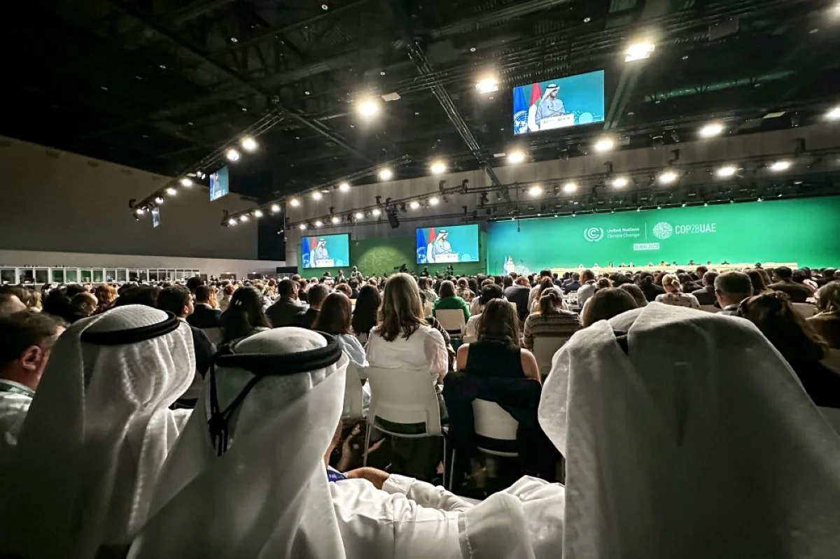 DUBAI: Participants attend a COP28 plenary session at the United Nations climate summit in Dubai on December 13, 2023. -- AFP