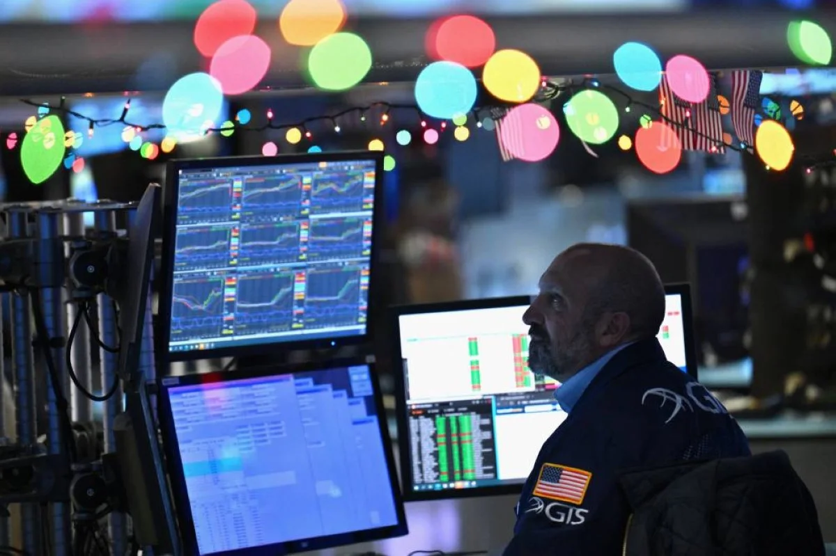 NEW YORK: Traders work on the floor of the New York Stock Exchange (NYSE) during morning trading on December 14, 2023, in New York City. – AFP