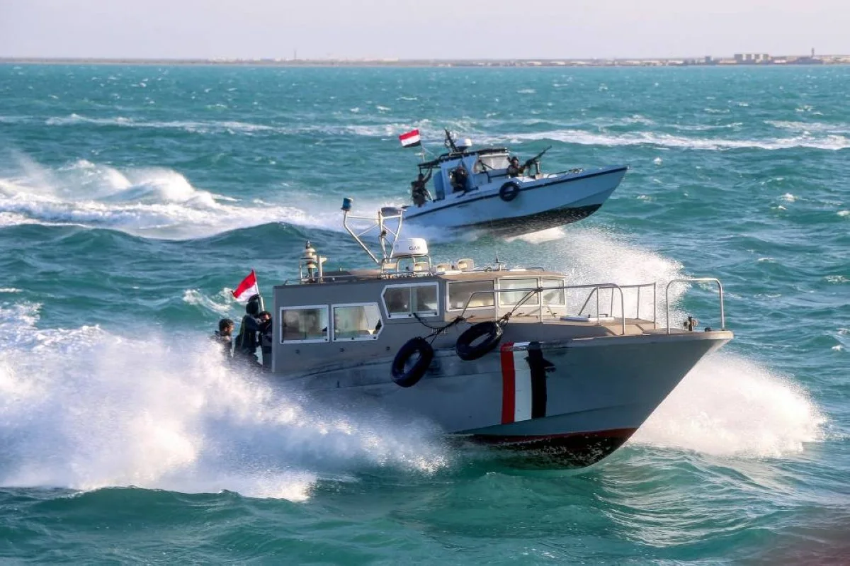 Yemeni coastguard members loyal to the internationally-recognized government ride in a speedboat and a patrol boat cruising in the Red Sea off of the government-held town of Mokha in the western Taiz province, close to the strategic Bab Al-Mandab Strait. – AFP