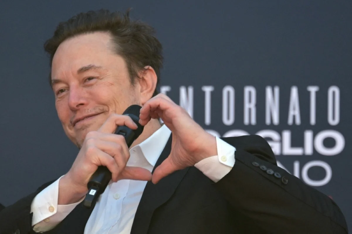 ROME: X CEO Elon Musk makes a heart with his hands during the Atreju political meeting organised by the young militants of Italian right wing party Brothers of Italy (Fratelli d'Italia) on December 16, 2023 at the Sant'Angelo Castle in Rome. -- AFP