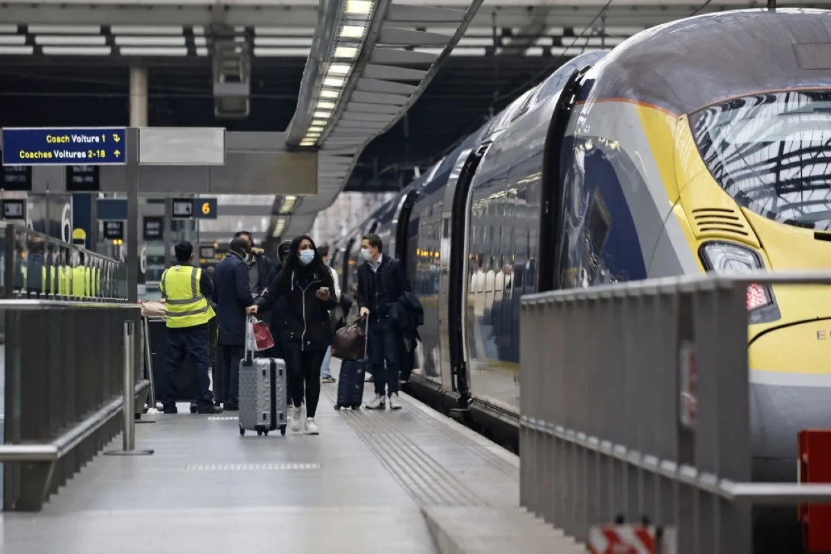 LONDON: Passengers board a Eurostar train at St Pancras International station in London.- AFP