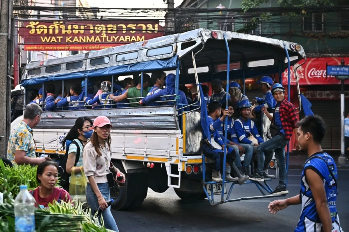 BANGKOK: Construction workers leave a construction site in the back of a truck in Chinatown in Bangkok on January 3, 2024. – AFP