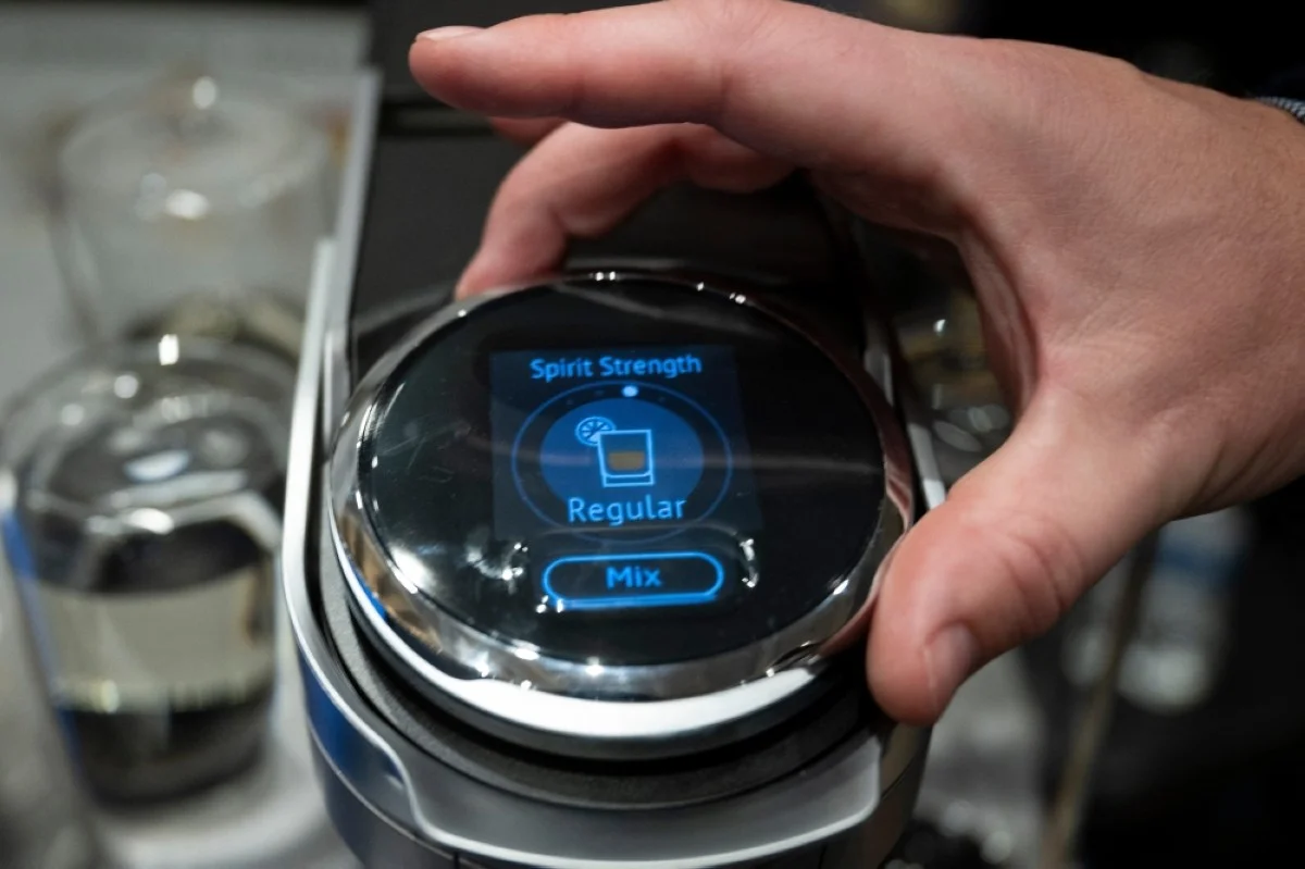 LAS VEGAS: A person adjusts settings on the Bartesian Premier, an automatic cocktail maker, during Pepcom’s Digital Experience at The Mirage resort during the Consumer Electronics Show (CES) in Las Vegas.- AFP