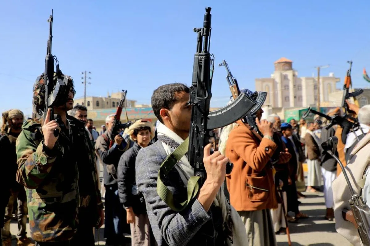 Huthi fighters brandish their weapons during a march in solidarity with the Palestinian people in the Huthi-controlled capital Sanaa on January 11, 2024.