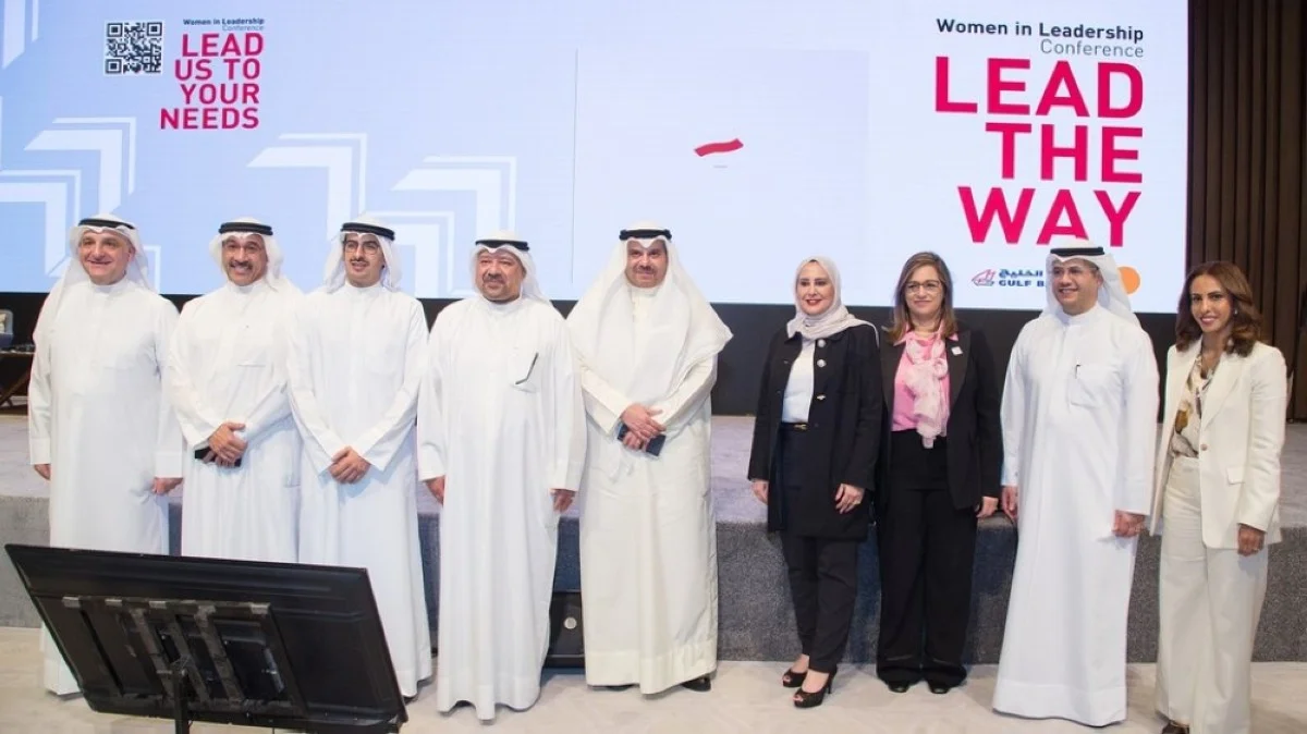 Jassim Boodai poses for a group photo with bank officials and guests of the Lead the Way conference.