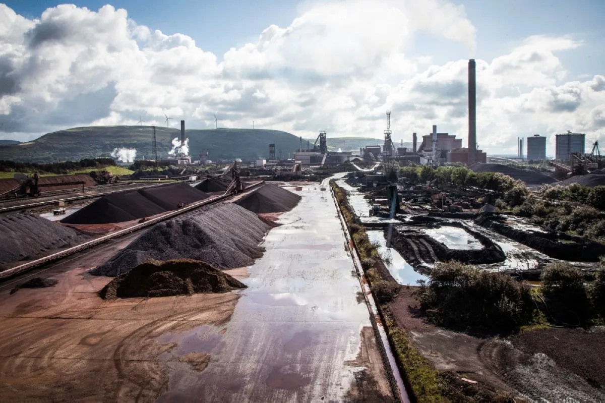 PORT TALBOT, United Kingdom: Raw materials to make iron sit in heaps at the Tata Steel Port Talbot integrated iron and steel works in south Wales. -- AFP

