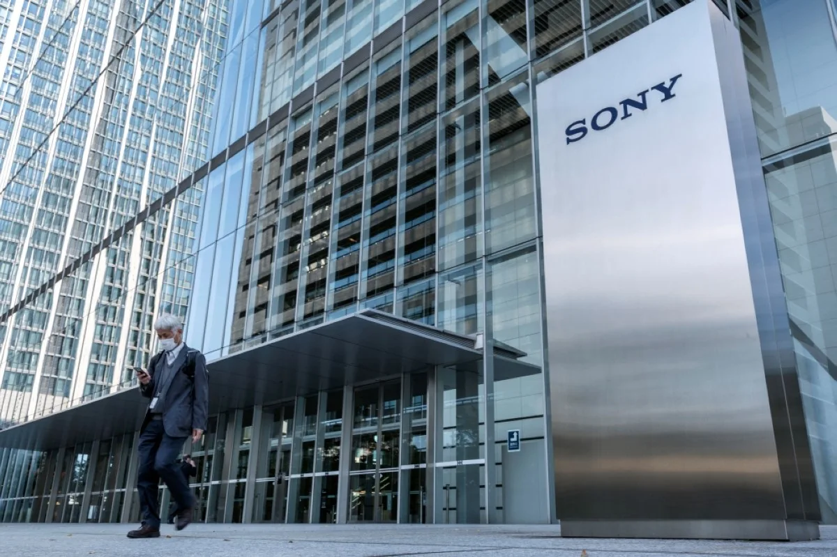 TOKYO: This file photo taken on Oct 31, 2022 shows a man walking past the Sony logo outside the company's headquarters in Tokyo. Sony confirmed on Jan 22, 2024 that it is pulling out a merger of its Indian business with local rival Zee Entertainment. – AFP