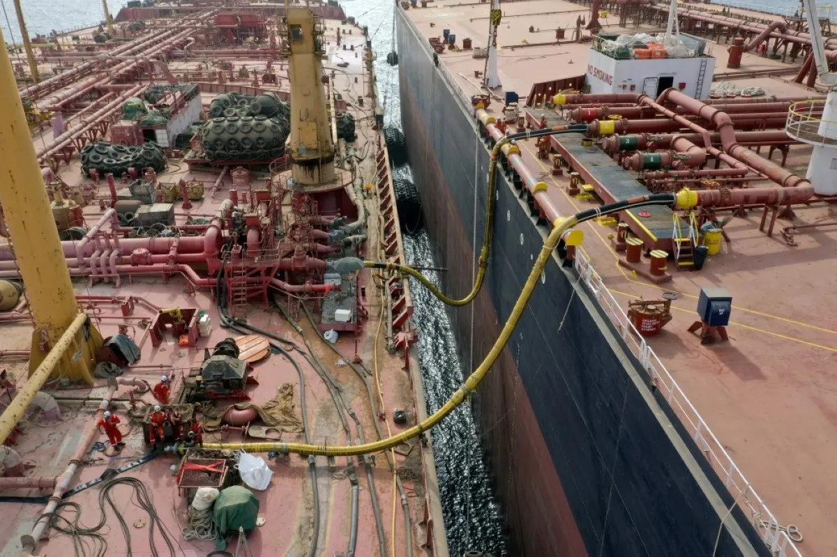 HODEIDA, Yemen: Workers gather on the deck of the tanker FSO Safer (left) as they get ready to transfer oil to the UN purchased vessel Nautica, in the Red Sea off the coast of Yemen's contested western province of Hodeida on July 24, 2023.—AFP