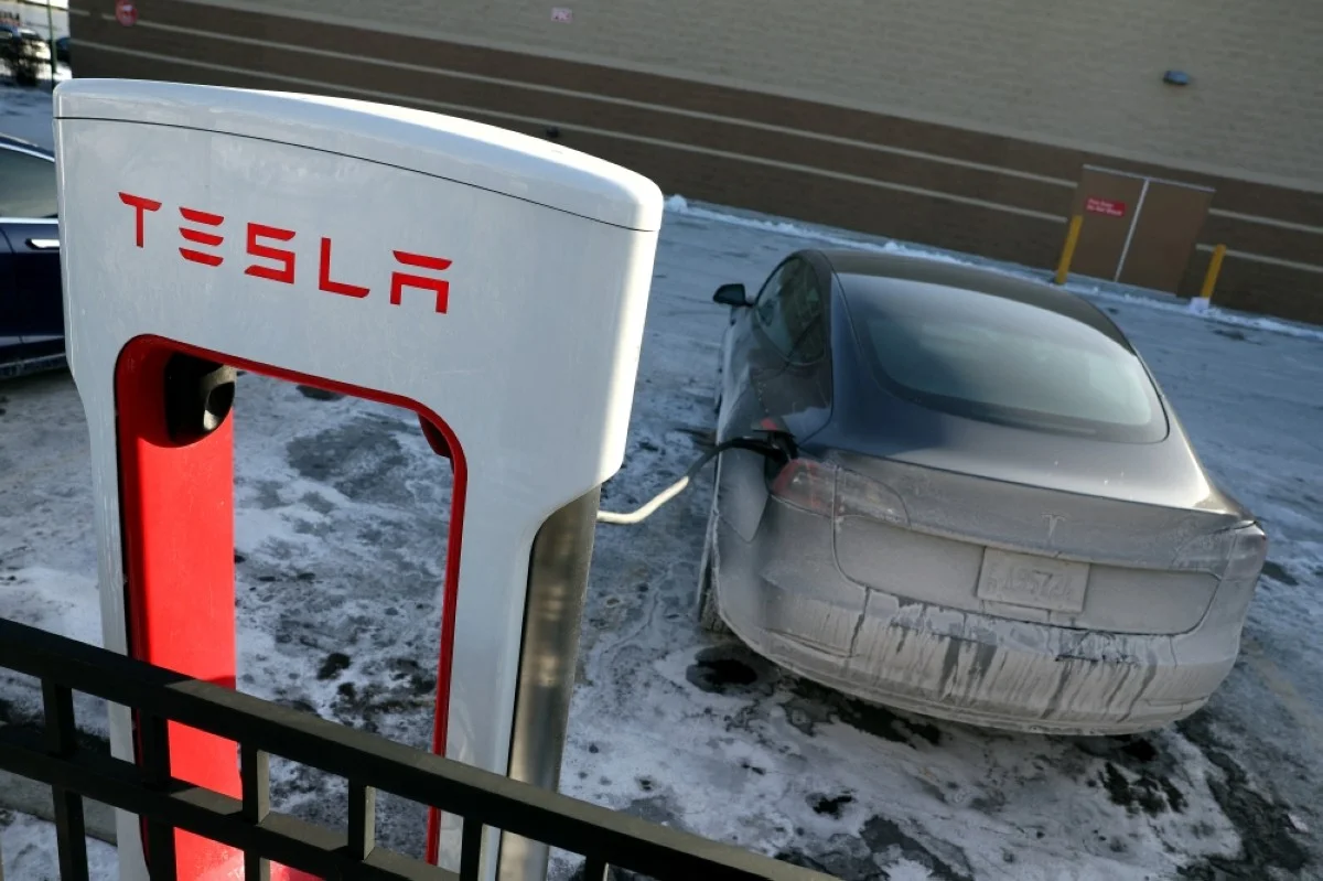 CHICAGO: A Tesla vehicle charges in a parking lot in Chicago, Illinois. - AFP