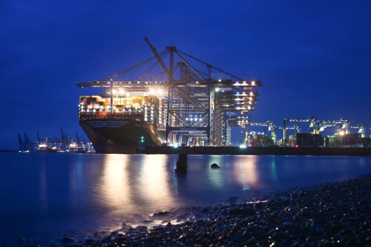 FELIXSTOWE, UK: Stacks of containers are pictured on the deck of the MSC Allegra container ship, docked beside container cranes at the UK's largest freight port, in Felixstowe on the East coast of England, on January 27, 2024. -- AFP