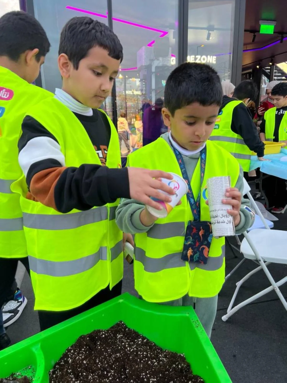 Children participate in a workshop on sustainable agricultural and gardening practices.