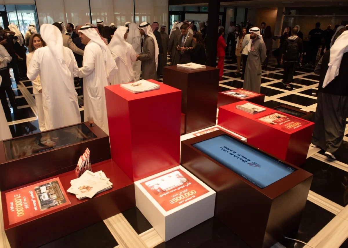 A small exhibition featuring photographs of previous millionaires from the Al-Danah account.