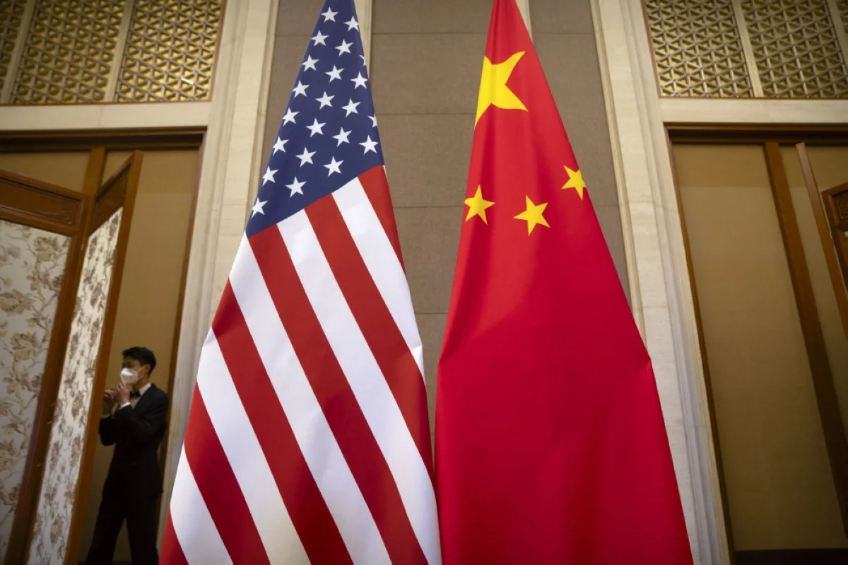 BEIJING: US and Chinese flags are seen before a meeting between US Treasury Secretary Janet Yellen and Chinese Vice Premier He Lifeng at the Diaoyutai State Guesthouse in Beijing on July 8, 2023. -- AFP