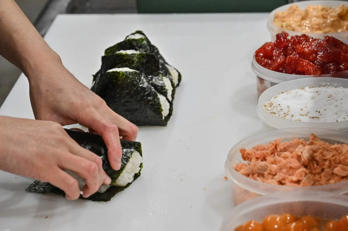 TOKYO: Photo shows a staff member making rice balls, known as ‘onigiri’, at the restaurant Onigiri Bongo in the Otsuka area of Tokyo.