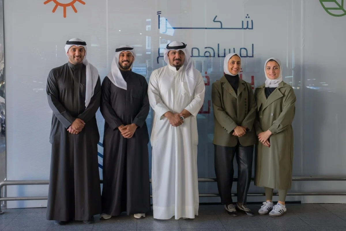 Gulf Bank's Corporate Communications team with Mishref Cooperative Society officials.