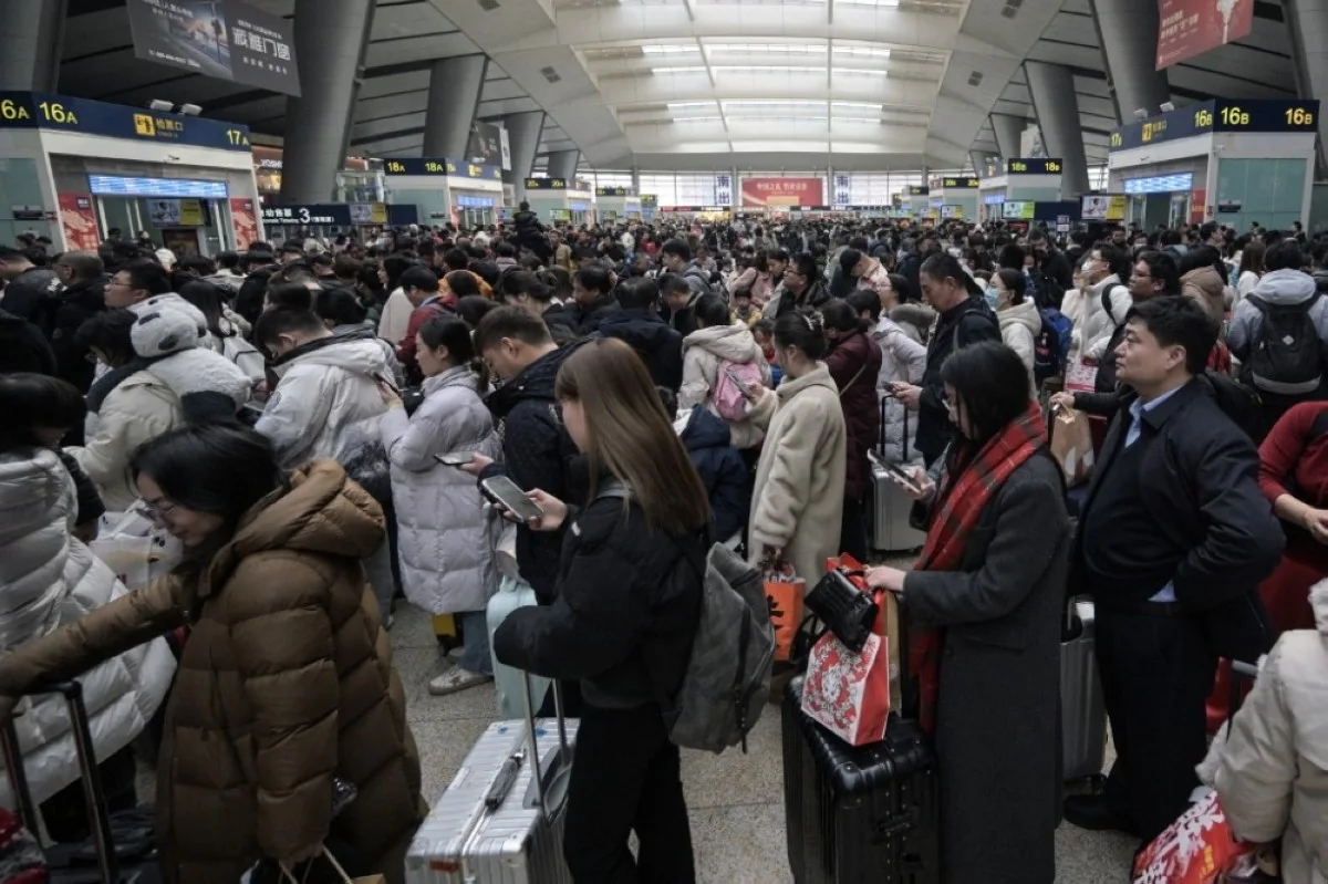 BEIJING: People queue to board trains at Beijing South Railway Station in Beijing on Feb 17, 2024 on the eighth day of the Lunar New Year of the Dragon. --AFP
