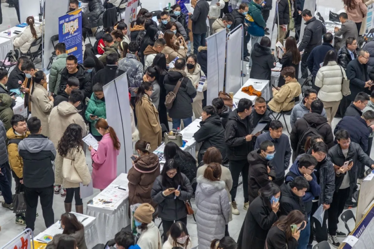 ZHENGZHOU, China: People attend a job fair in Zhengzhou, in central China's Henan province on February 19, 2024. -AFP