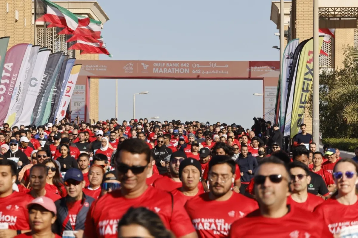 Thousands start the race after the start signal sounds from Souq Sharq.