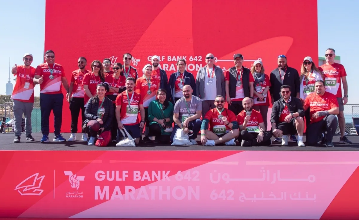 A group photo of the Gulf Bank team with senior executive management officials.