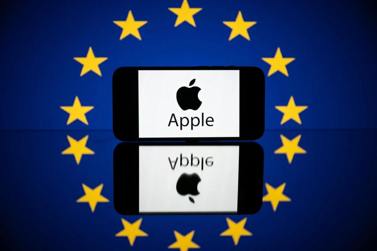 This picture in Toulouse, shows a screen displaying the Apple logo and the European flag. - AFP