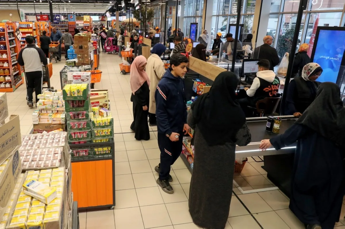 TRIPOLI: Libyans shop at a supermarket in Tripoli. Libya may be sitting on Africa's biggest oil reserves, but many families are struggling with rapidly rising consumer prices as the festive Muslim holy month of Ramadan nears. – AFP