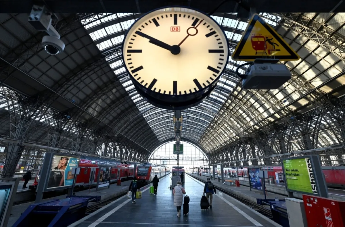 FRANKFURT: Train passengers are seen on a platform at the main railway station in Frankfurt am Main, western Germany, as German train drivers stage a strike. – AFP