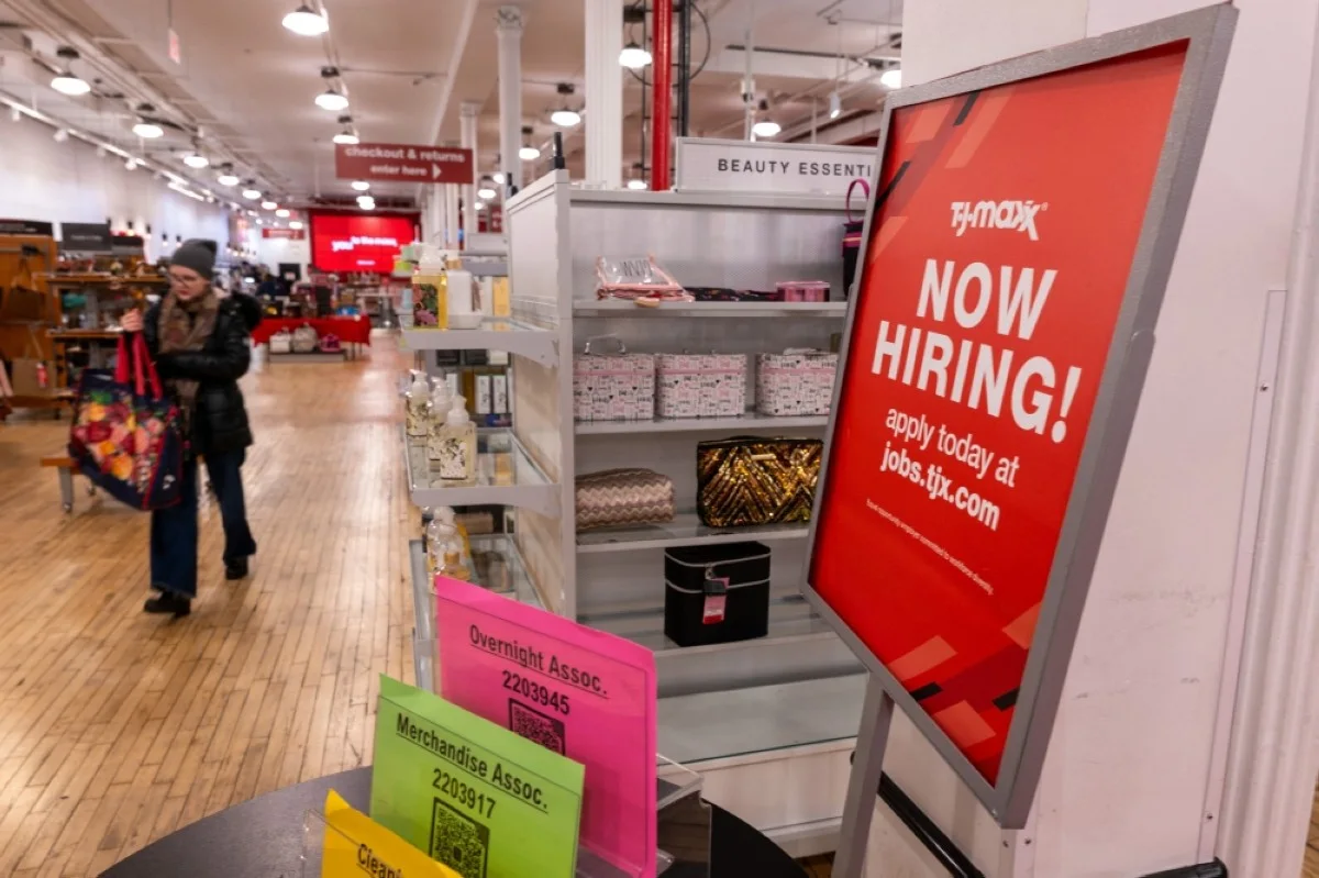NEW YORK: A 'now hiring' sign is displayed in a retail store in Manhattan in New York City. -- AFP
