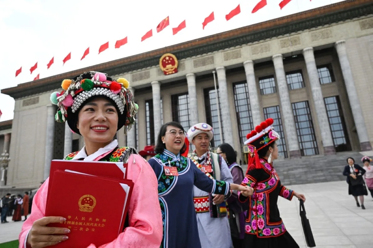BEIJING: Delegates leave after the closing session of the 14th National People's Congress (NPC) at the Great Hall of the People in Beijing on March 11, 2024. – AFP