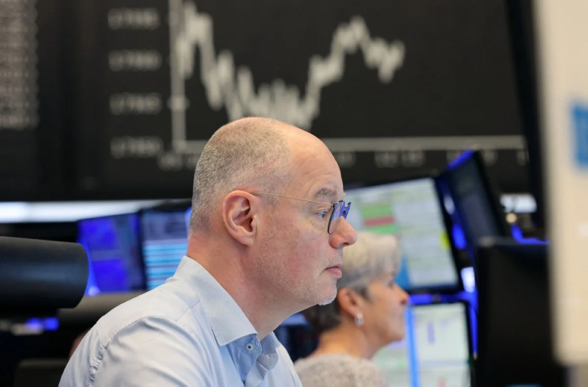 FRANKFURT: Brokers are pictured at the stock exchange in Frankfurt, Germany. German stocks soared past 18,000 points on Thursday hitting a new record high, on growing expectations that central banks will begin cutting interest rates this year. — AFP