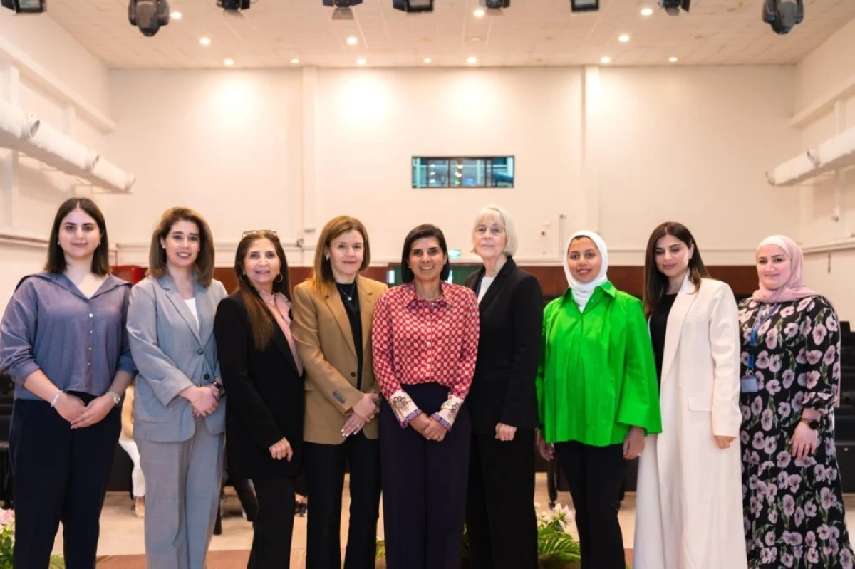 Najla Al-Eisa poses for a group photo during Bayan School's International Women's Day celebration.