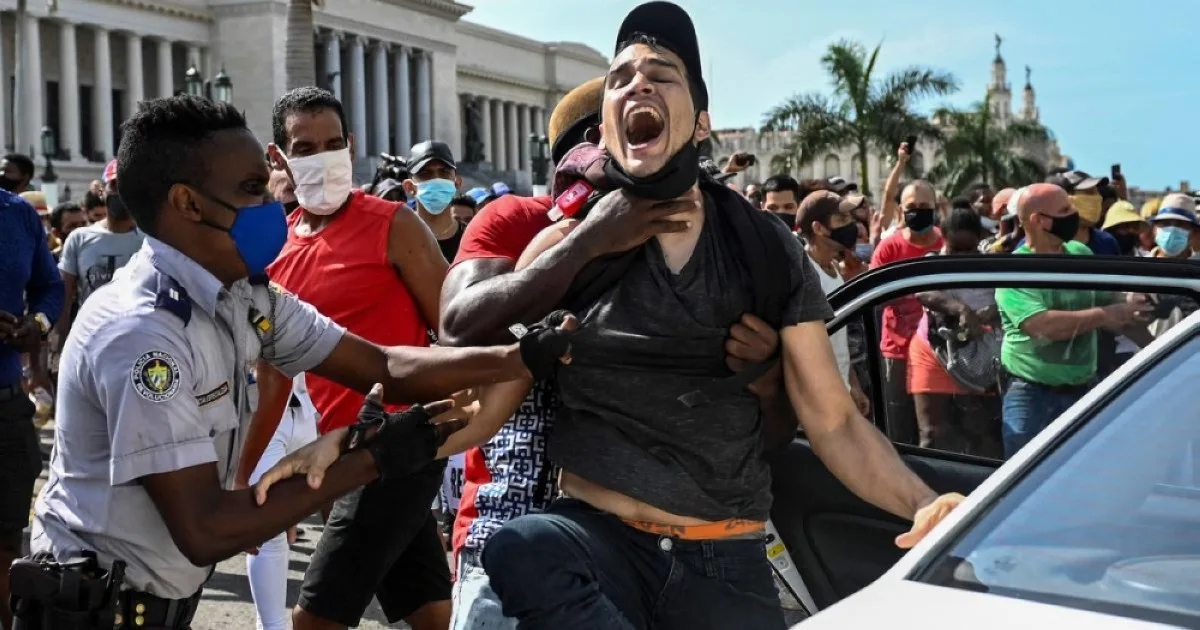 HAVANA: A man is arrested during a demonstration against the government of Cuban President Miguel Diaz-Canel in Havana. -- AFP