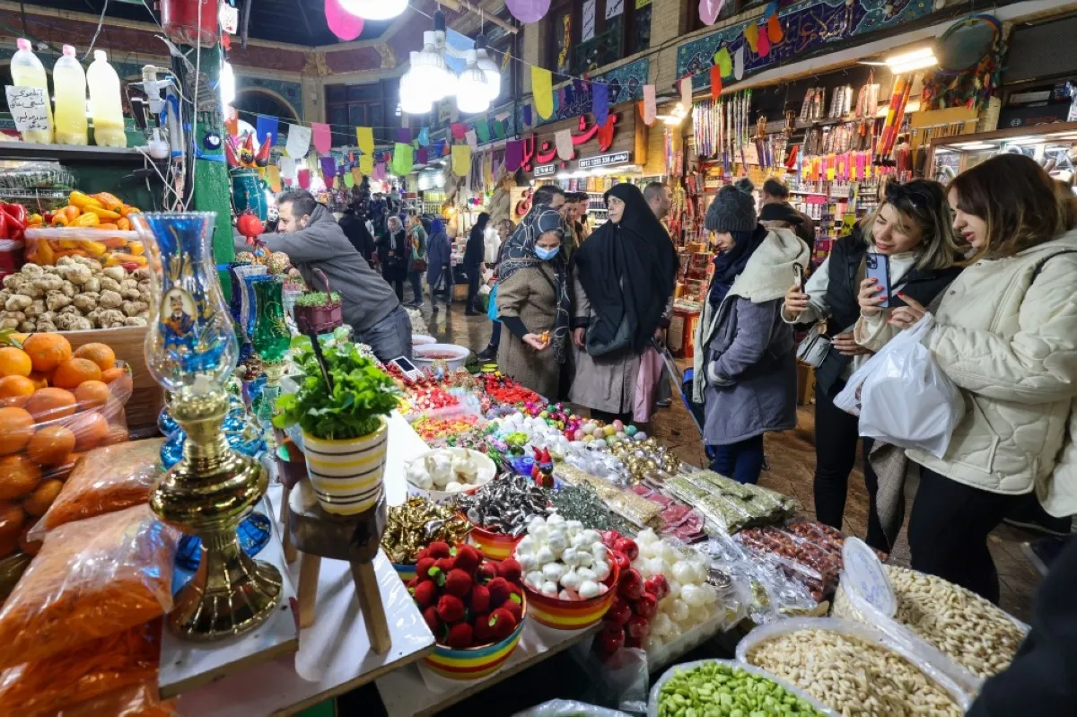 TEHRAN: People shop at a market in Tehran as they prepare for Nowruz, the Persian New Year. – AFP