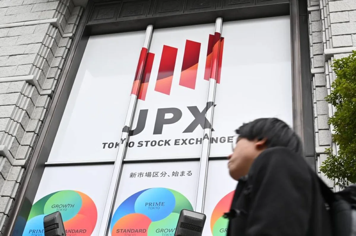 TOKYO: A man walks in front of the Tokyo Stock Exchange (TSE) in Tokyo on March 19, 2024. -- AFP