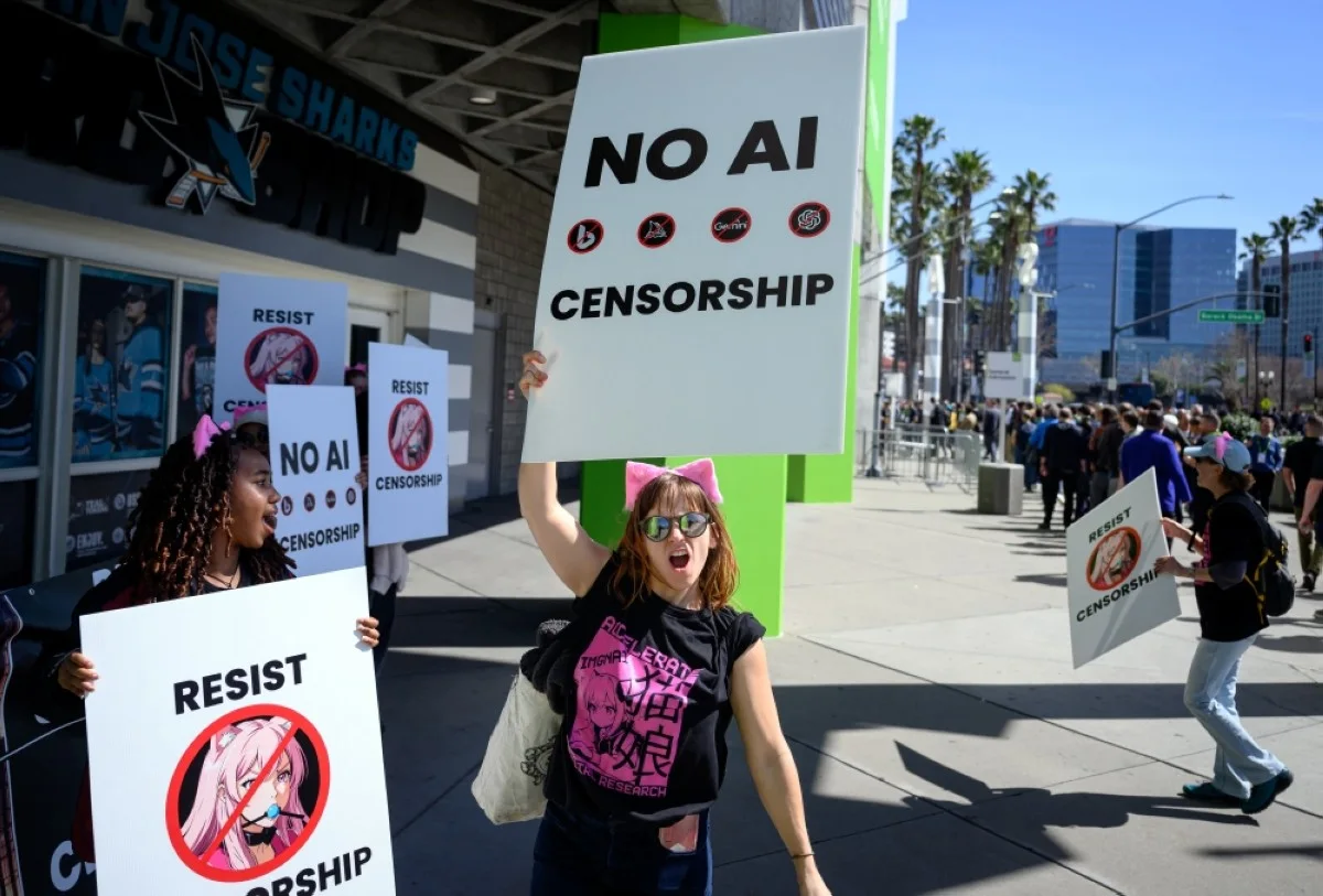 SAN JOSE, United States: Protesters shout outside the annual Nvidia GTC Artificial Intelligence Conference at SAP Center in San Jose, California, on March 18, 2024.  -- AFP