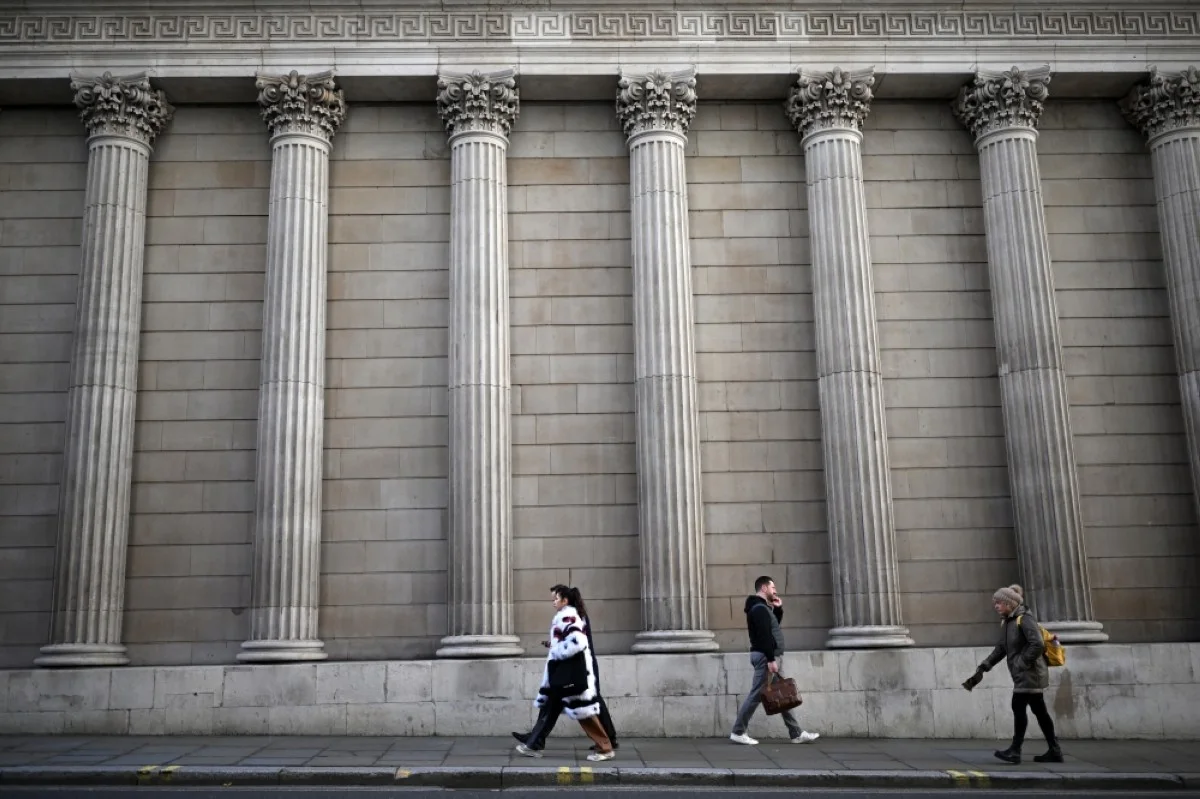 LONDON: Pedestrians walk past the Bank of England, Britain’s central Bank, in London.- AFP