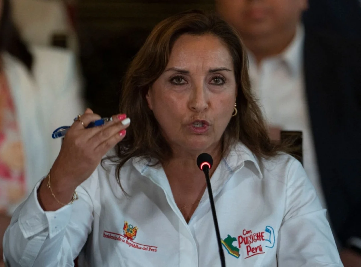 Peruvian President Dina Boluarte, accompanied by her ministerial team, speaks during a press conference in Lima. -- AFP