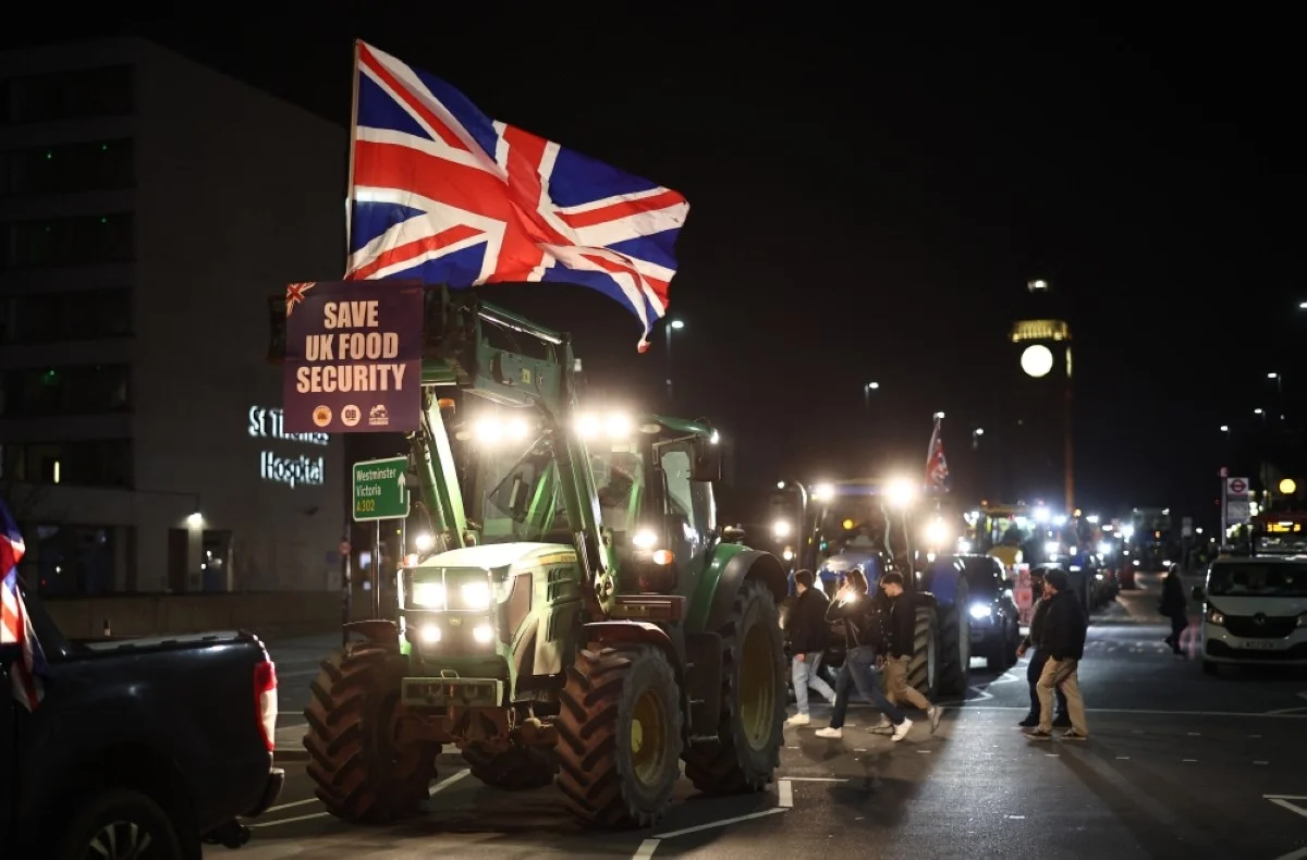 LONDON: Farmers drive tractors back to the start point after a demonstration organised by Save British Farming against UK food policy, substandard imports and stricter food labelling regulations, in central London on March 25, 2024. -- AFP