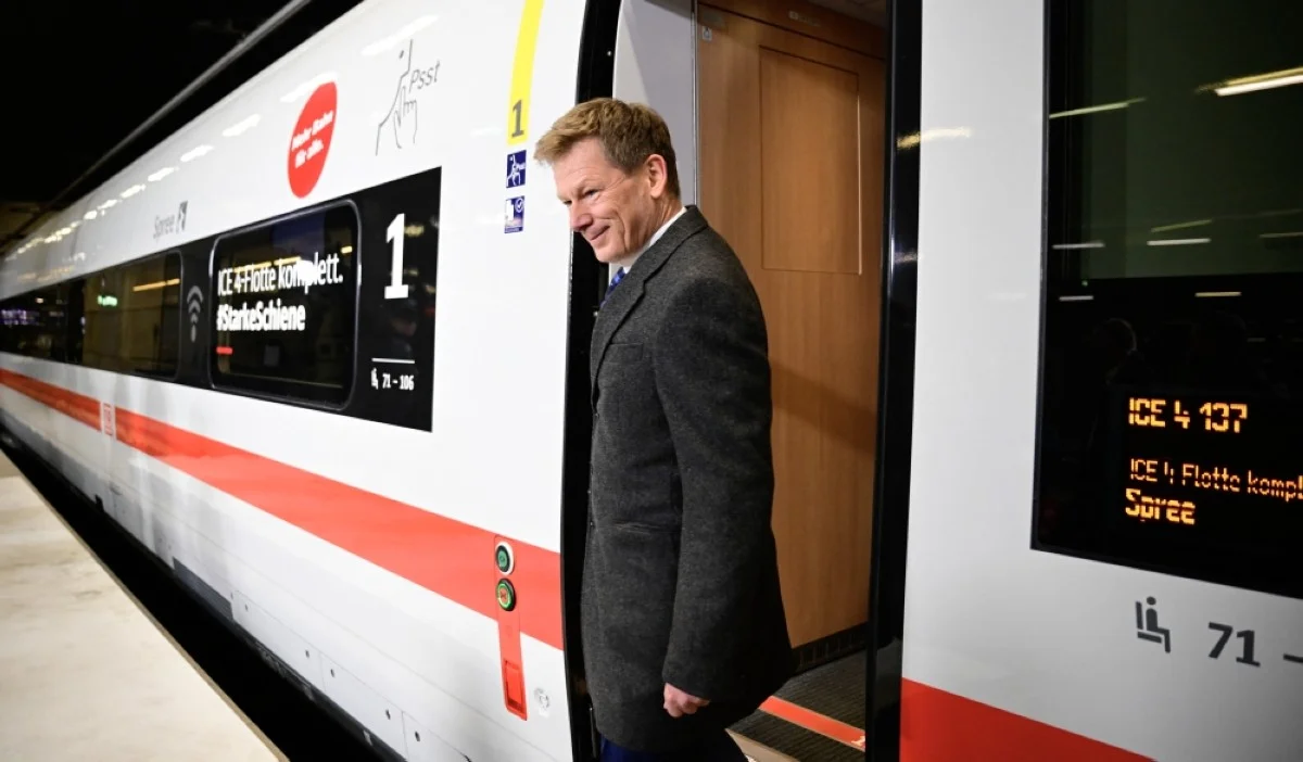 BERLIN: The CEO of German railway operator Deutsche Bahn (DB) Richard Lutz gets out of high-speed ICE 4 train "Spree" during its christening at Berlin's main station (Hauptbahnhof) in Berlin. -- AFP