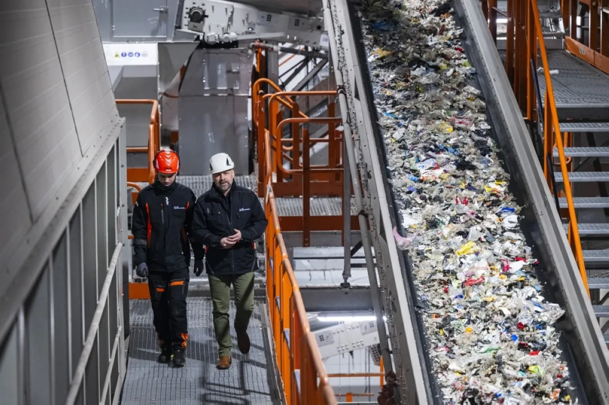 MOTALA, Sweden: Mattias Philipsson, CEO of Svensk Plastatervinning walks with an employee at the Site Zero recycling facility in Motala, Sweden. -- AFP