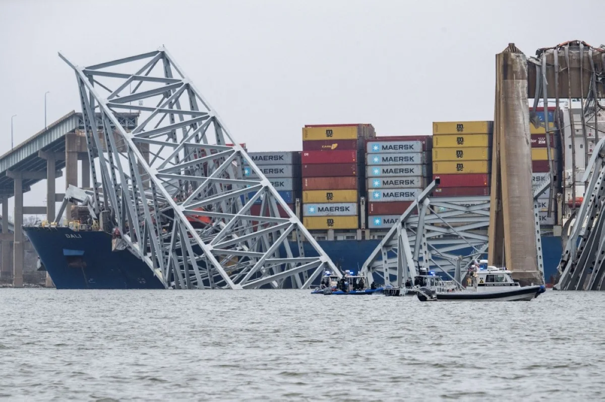 BALTIMORE, USA: The collapsed Francis Scott Key Bridge lies on top of the container ship Dali in Baltimore, Maryland, on March 27, 2024. -- AFP
