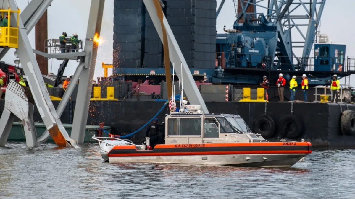 BALTIMORE, US: Demolition crews cutting the top portion of the north side of the collapsed Francis Scott Key Bridge into smaller sections for safe removal by crane in the Patapsco River, in Baltimore, Maryland, on March 30, 2024. -- AFP