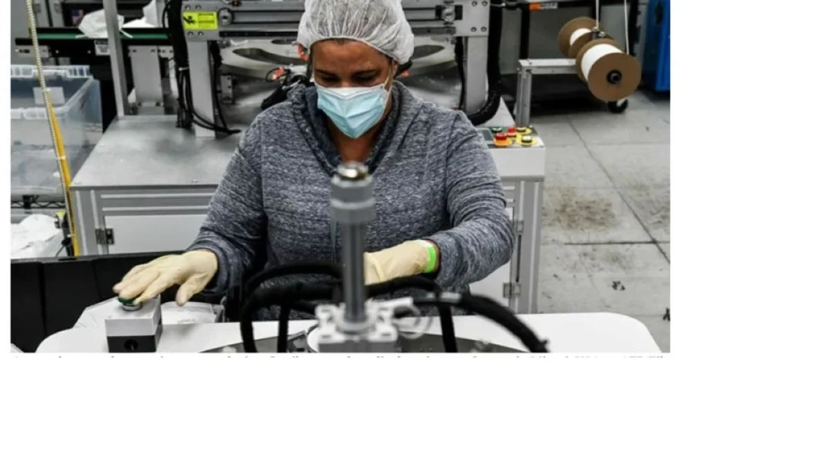 An employee makes respiratory masks in a family-owned medical equipment factory in Miami, USA. — AFP