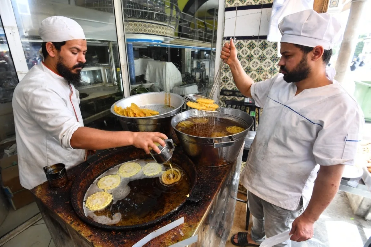 TUNIS: Employees make sweets at a bakery in Tunis during the holy fasting month of Ramadan amid a shortage of sugar supplies in the country. – AFP